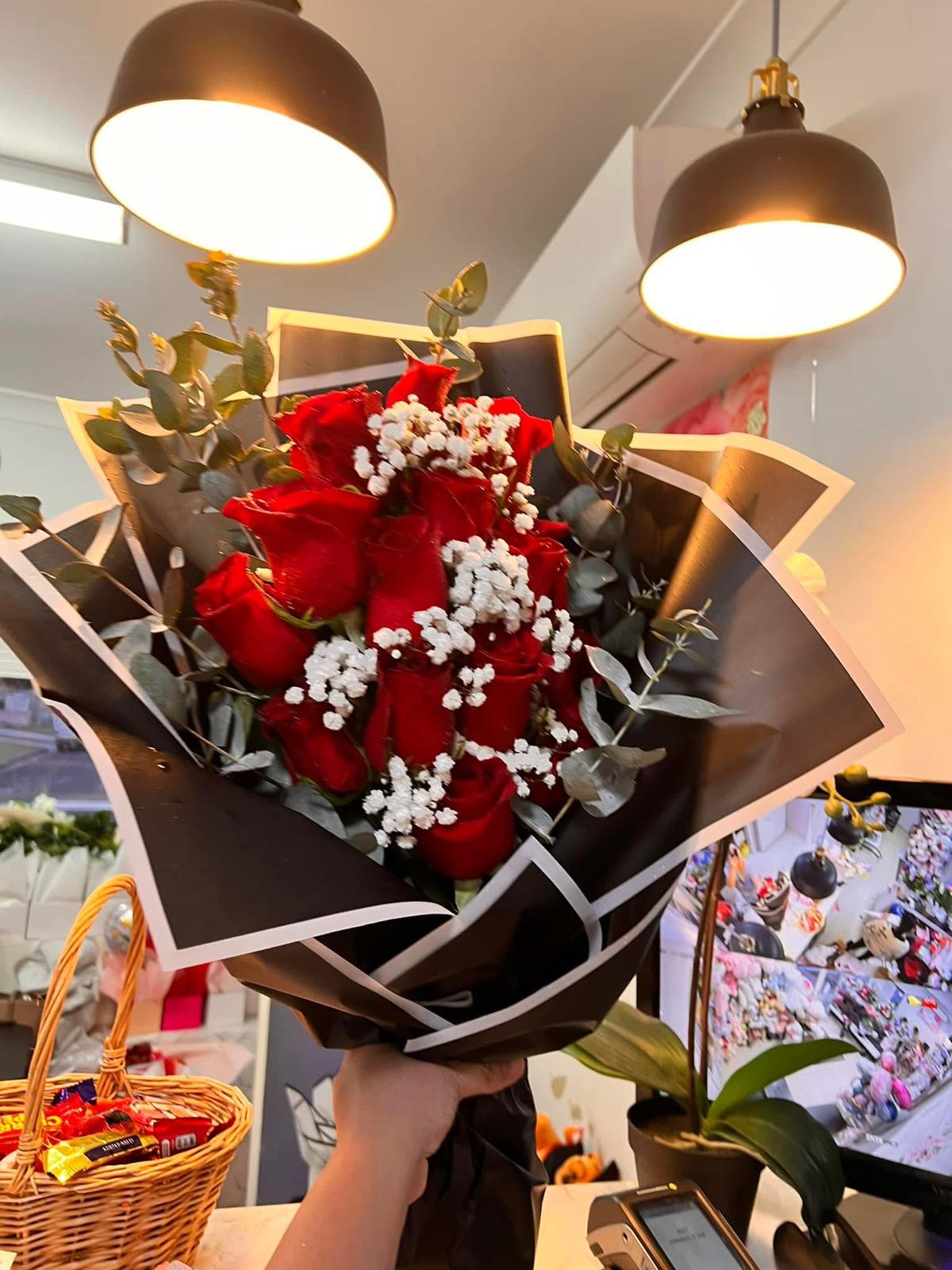 Premium red rose bouquet wrapped in black paper